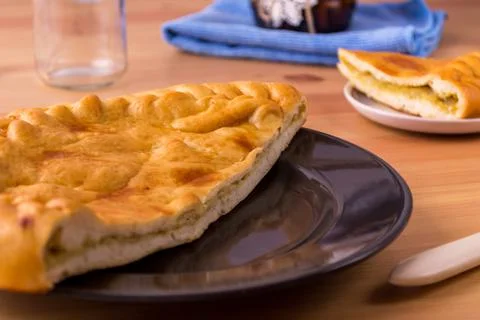 Pie on a plate on the table. Breakfast or lunch. Food photo. Stock Photos
