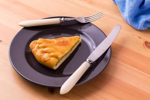 Pie on a plate on the table. Breakfast or lunch. Food photo. Stock Photos