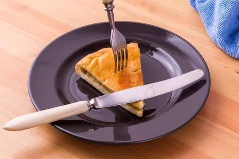 Pie on a plate on the table. Breakfast or lunch. Food photo. Stock Photos