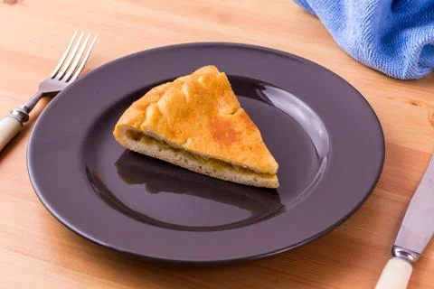 Pie on a plate on the table. Breakfast or lunch. Food photo. Stock Photos