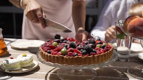 Pie with red berries, plates and cakes Stock Footage 314023019