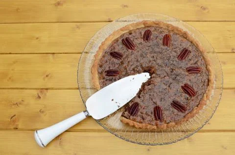 Pie server in a sliced pecan pie Stock Photos