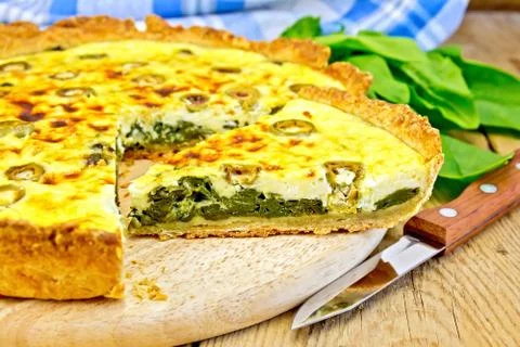 Pie with spinach on the board Stock Photos
