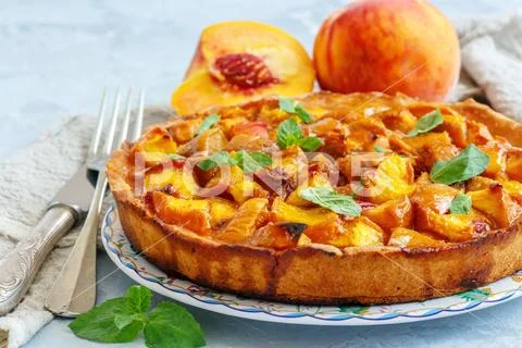Pie stuffed with fresh peaches. Stock Photos