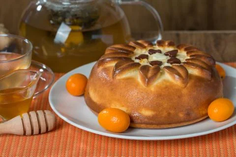 Pie with tea on orange background Stock Photos