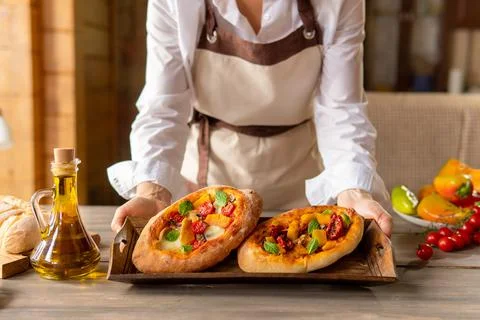 A pie with vegetables on a dark background. Breakfast is an appetizer. Stock Photos