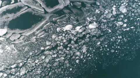 A Pieaces of ice sheets drifting in Lake George in New York duirng winter Stock Footage 155514599