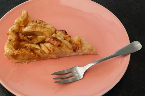 Piece of apple tart on a plate Stock Photos