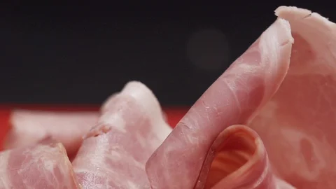 Piece of bacon being handled by kitchen staff Stock Footage 128822640