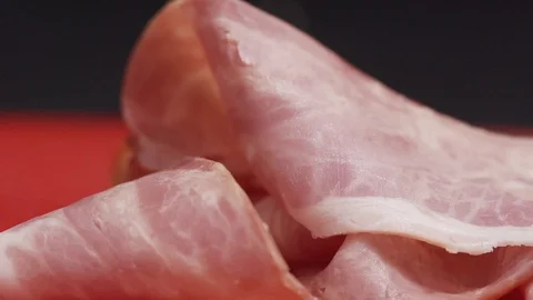 Piece of bacon being handled by kitchen staff Video stock 128822721