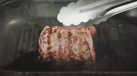 A piece of beef fried in a pan Stock Footage 54109780