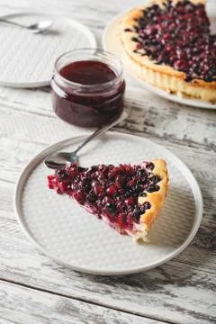 Piece of berry pie with cherry, currant, blackberry, blueberry with kitchenwa Stock Photos