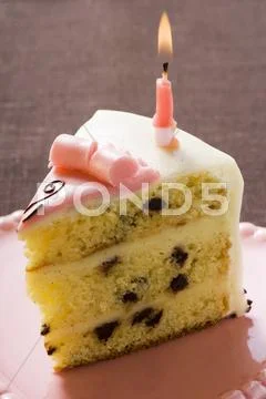 Piece Of Birthday Cake With Candle