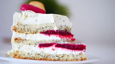 Piece of bitten off cake with raspberry Stock Footage 155550437