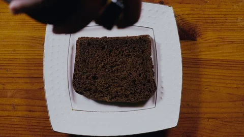 A piece of black bread watered with olive oil Stock Footage 103166121