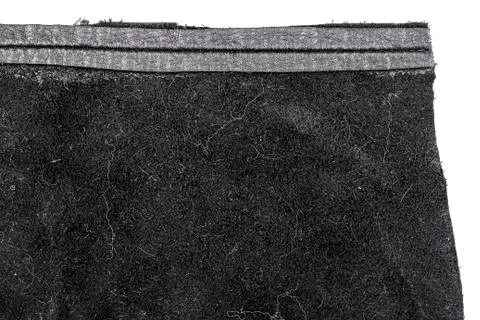 Piece of black leather, back side Stock Photos