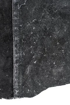 Piece of black leather, back side Stock Photos