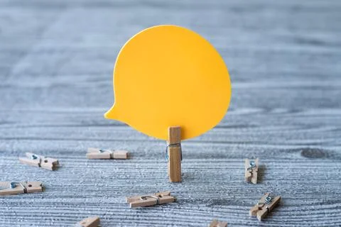 Piece Of Blank Speech Bubble Surrounded By Laundry Clips Showing New Meanin.. Stock Photos