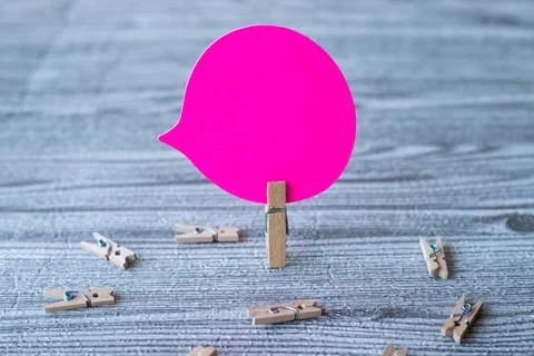 Piece Of Blank Speech Bubble Surrounded By Laundry Clips Showing New Meanin.. Stock Photos