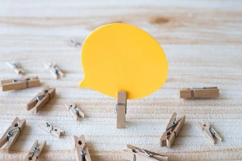 Piece Of Blank Speech Bubble Surrounded By Laundry Clips Showing New Meanin.. Stock Photos