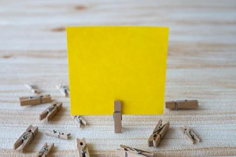 Piece Of Blank Square Note Surrounded By Laundry Clips Showing New Meaning... Stock Photos