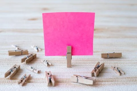 Piece Of Blank Square Note Surrounded By Laundry Clips Showing New Meaning... Stock Photos