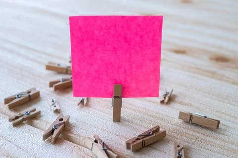 Piece Of Blank Square Note Surrounded By Laundry Clips Showing New Meaning... Stock Photos