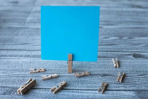 Piece Of Blank Square Note Surrounded By Laundry Clips Showing New Meaning... Stock Photos