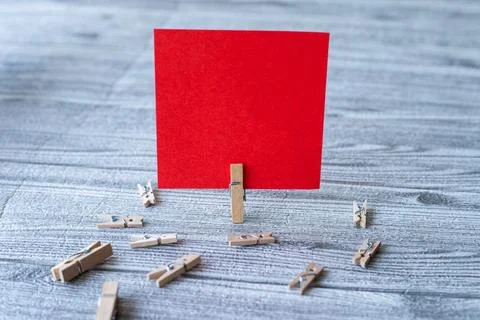 Piece Of Blank Square Note Surrounded By Laundry Clips Showing New Meaning... Stock Photos