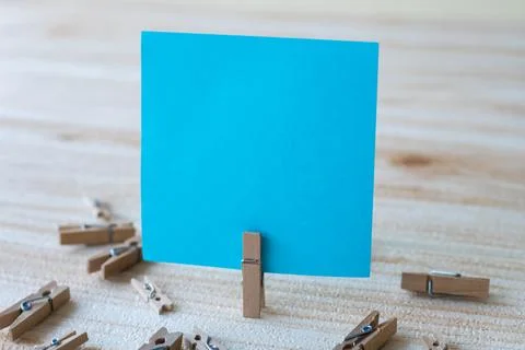 Piece Of Blank Square Note Surrounded By Laundry Clips Showing New Meaning... Stock Photos
