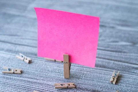 Piece Of Blank Square Note Surrounded By Laundry Clips Showing New Meaning... Stock Photos