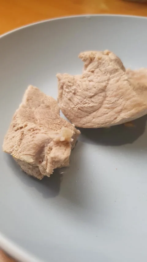 A piece of boiled fresh meat vertical video. A serving of boiled pork Stock Footage 345743039
