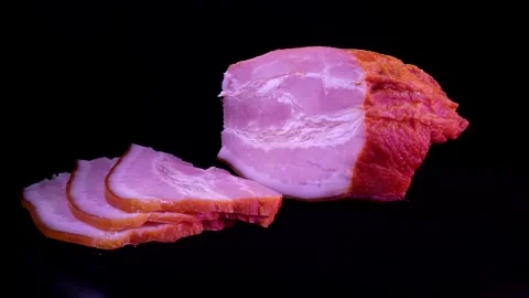A piece of boiled pork on a dark background Stock Footage 154552370