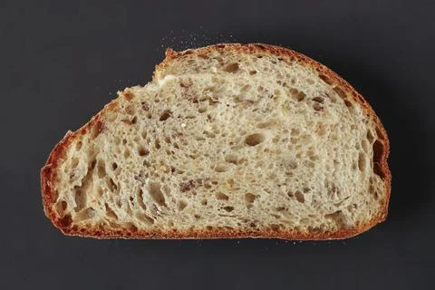 Piece of bread on black Stock Photos