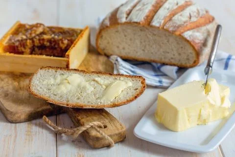 Piece of bread with butter close up. Stock Photos