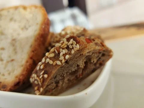 A piece of bread on a plate Stock Photos