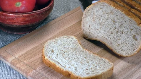 Piece of bread slowly falls Stock Footage 92496736