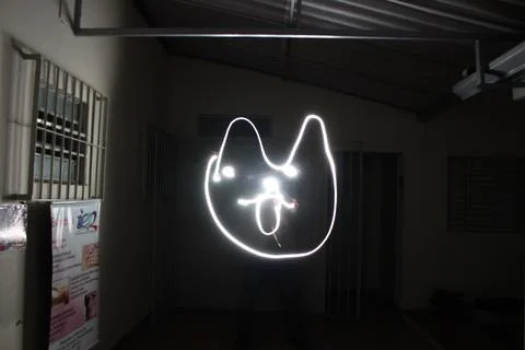 Piece of bright light with an abstract shape illustrated on a dark background Stock Photos