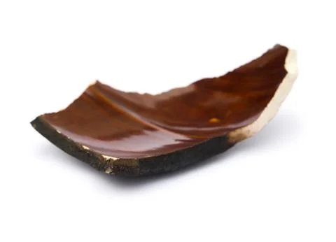 Piece of broken clay on a white background Stock Photos