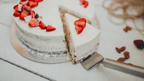 Piece of cake on the blade. Cut the cake. Cake under the curd cream under strawb Stock Footage 86367634