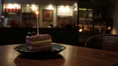 A piece of cake with a candle Stock Footage 223882259