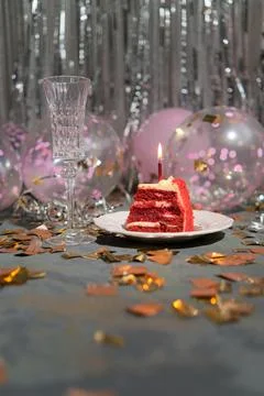 A piece of cake with a candle Stock Photos