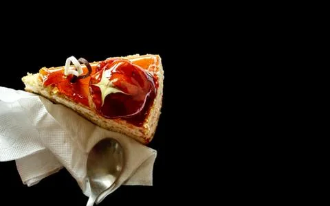 Piece of cake isolated on black background Stock Photos