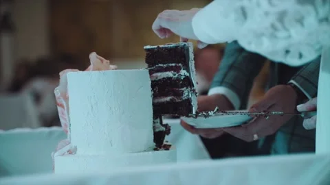 A piece of cake is placed on a plate Stock Footage 169273369