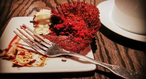 A piece of cake on a plate with a fork 库存照片