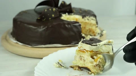 A piece of cake on a plate. The process of eating a cake. Stock Footage 152875295