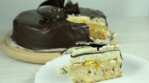 A piece of cake on a plate while eating with a spoon. Stock Footage 152874670