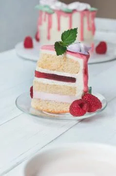 Piece of cake with a raspberry on plate Stock Photos