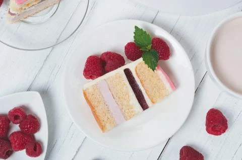 Piece of cake with a raspberry on plate Stock Photos