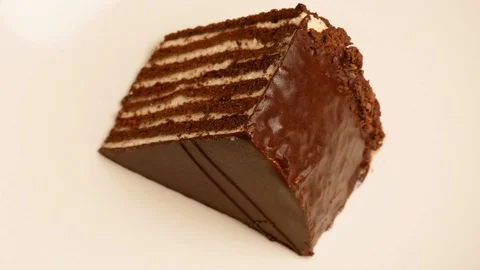 Piece of cake rotates around its own axis, close-up. Stock Footage 107730657